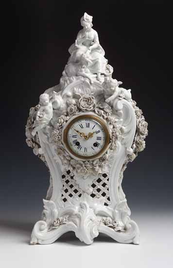A 19th century porcelain cased blanc de chine mantel clock
