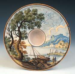 An unusual Italian Castelli maiolica socketed saucer