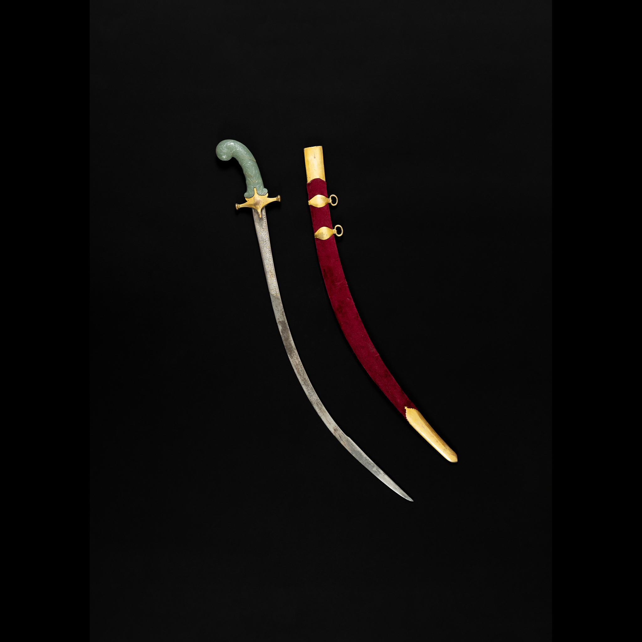 A MUGHAL JADE-HILTED STEEL SWORD (TALWAR)