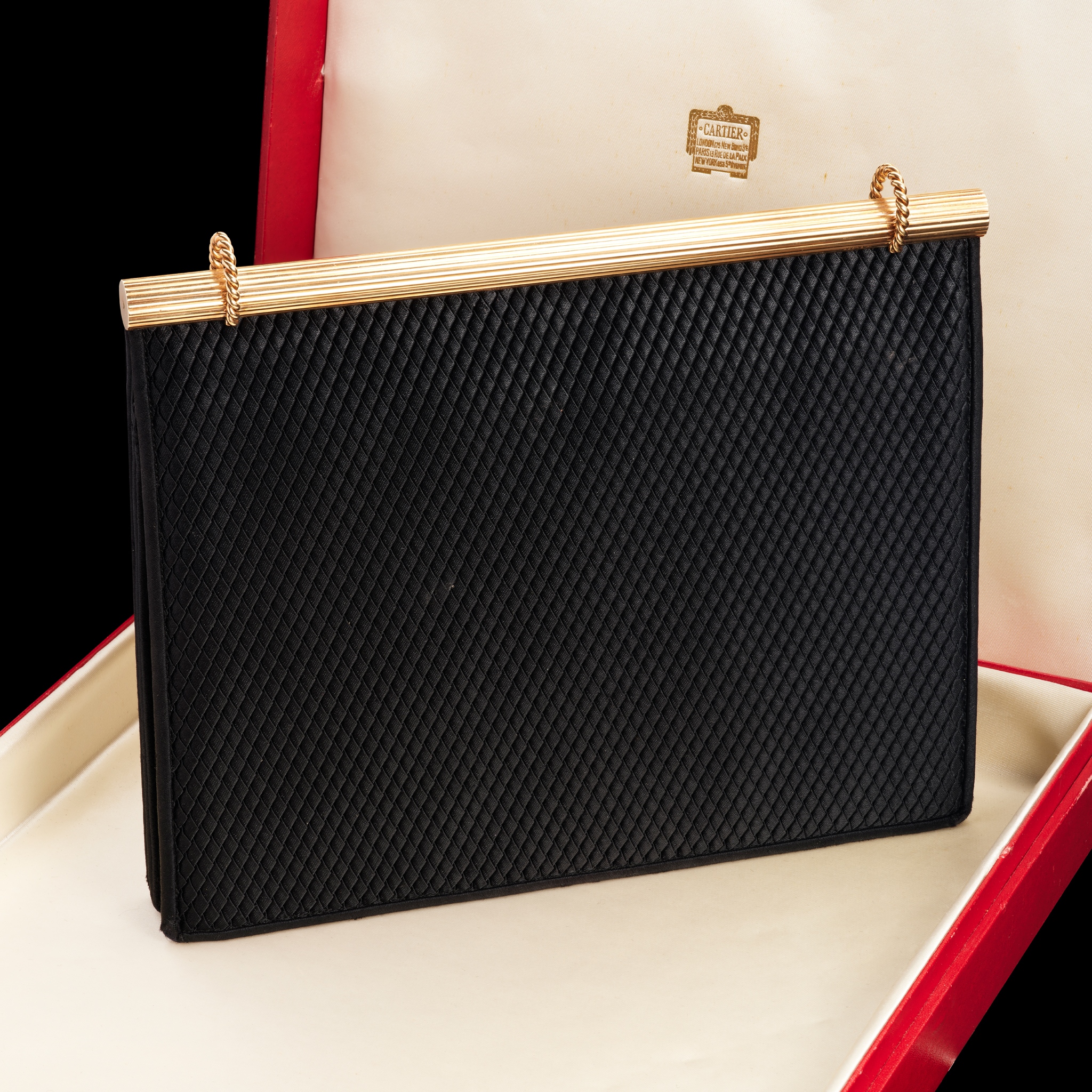 Cartier: A gold and silk handbag