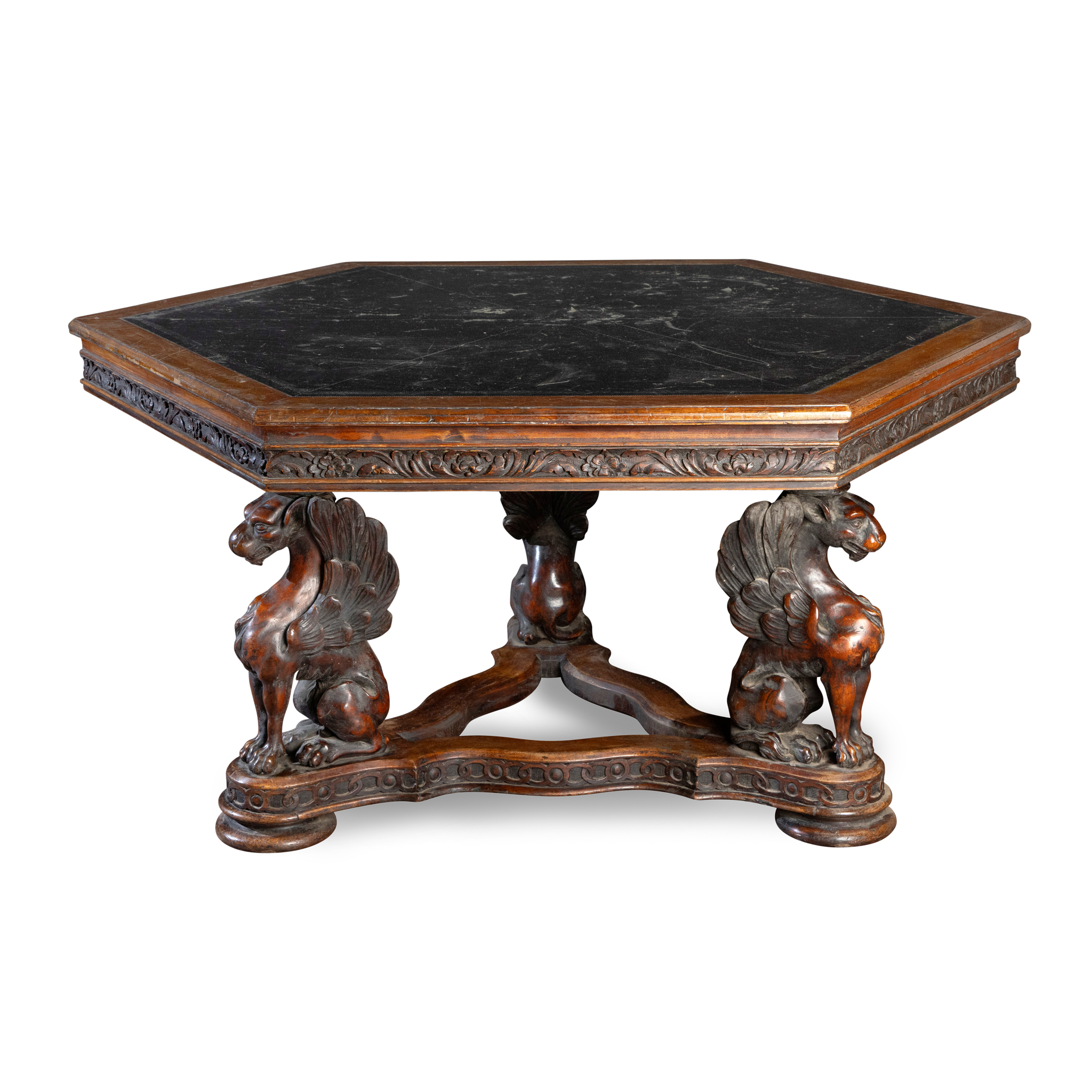 A VICTORIAN CARVED WALNUT HEXAGONAL LIBRARY TABLE