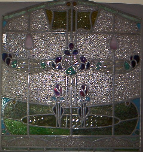 A pair of stained and leaded glass panels