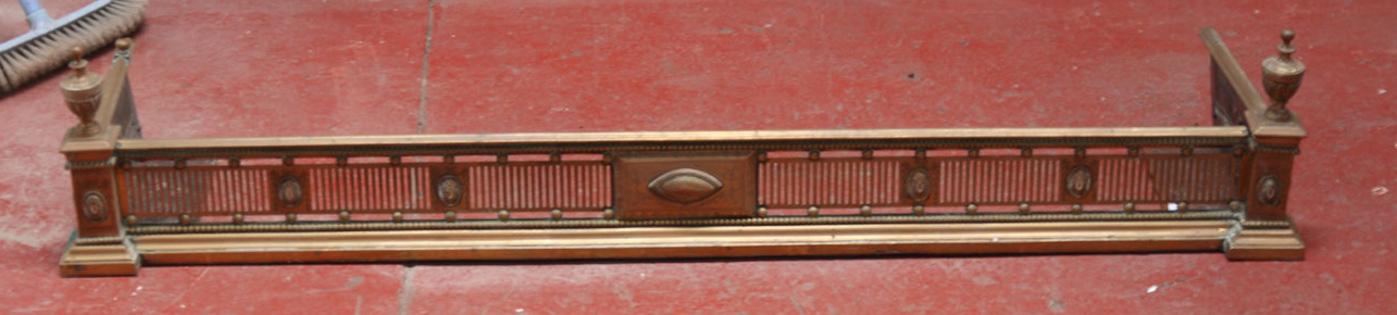 A Regency period brass fender