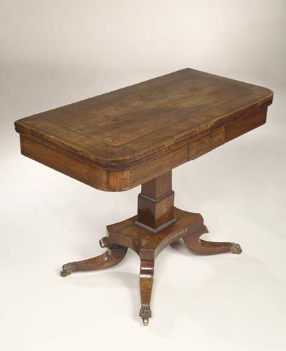 A Regency rosewood and brass inlaid foldover card table,