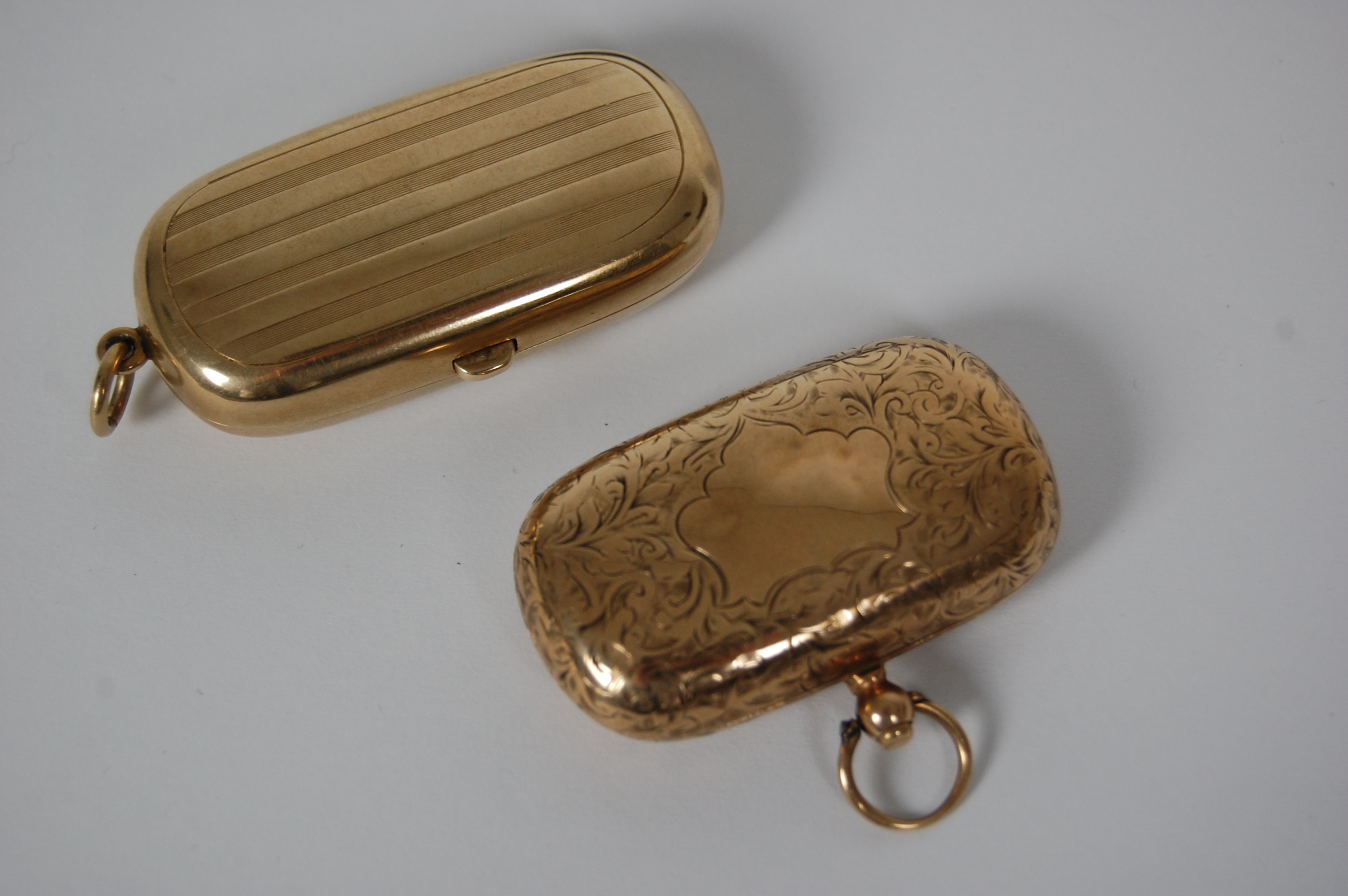 Two 9ct gold double sovereign cases