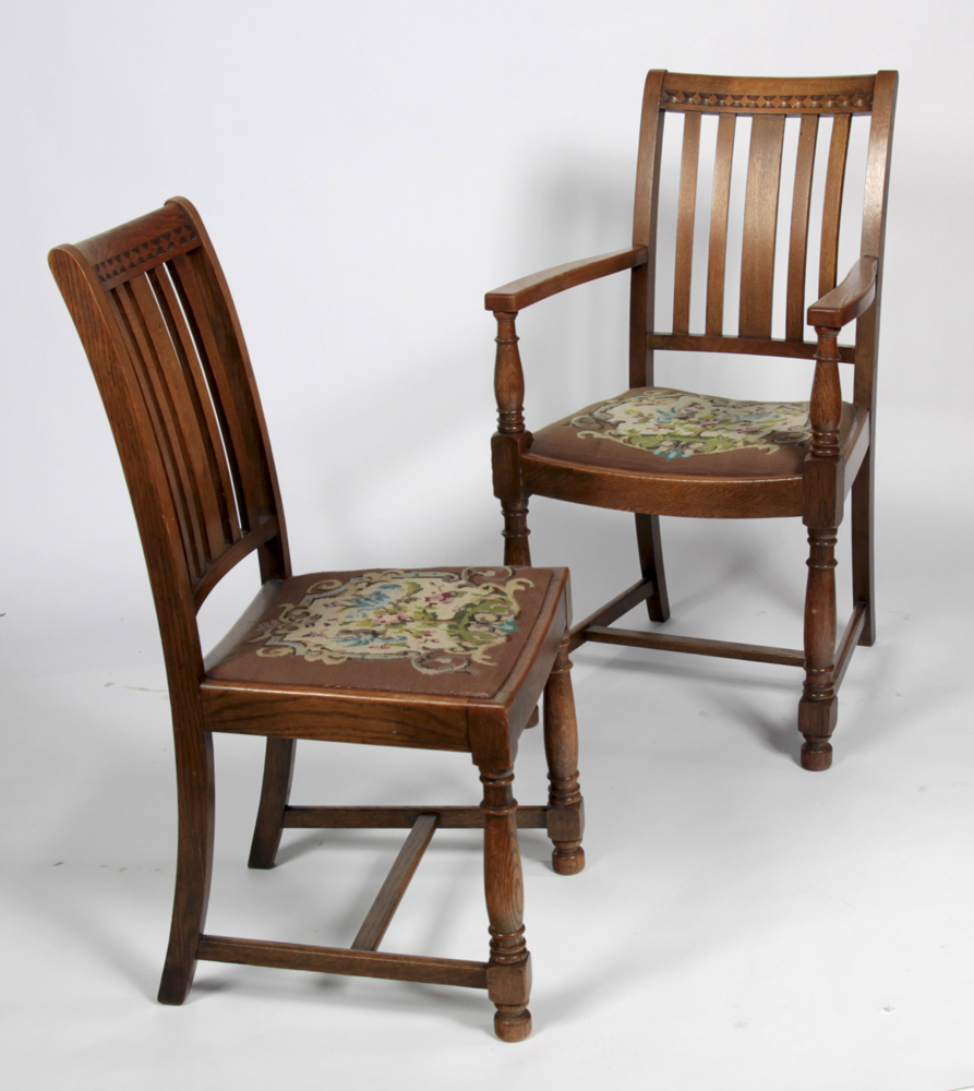 A set of eight early 20th century oak dining chairs