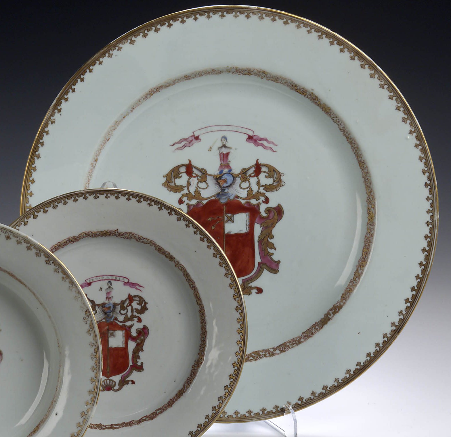 A set of four large circular Chinese 18th century export armorial chargers