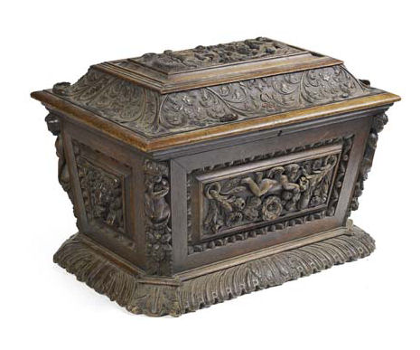 An early 19th century Continental carved oak cellarette In the Baroque manner