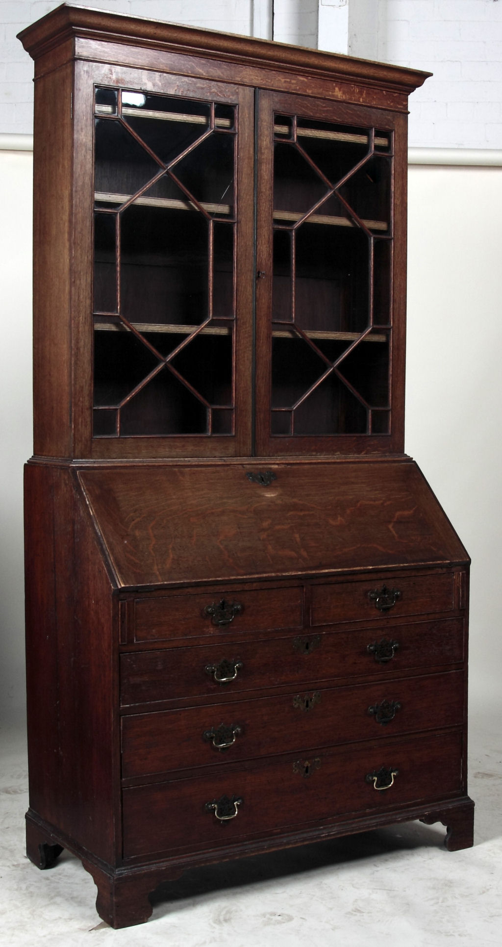 A George III oak bureau bookcase
