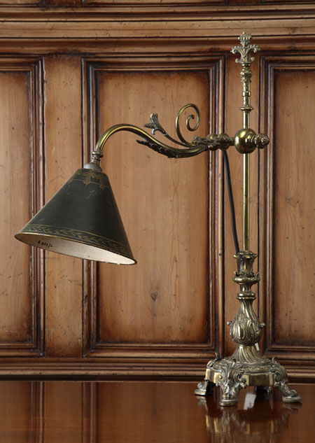 A brass adjustable table lamp