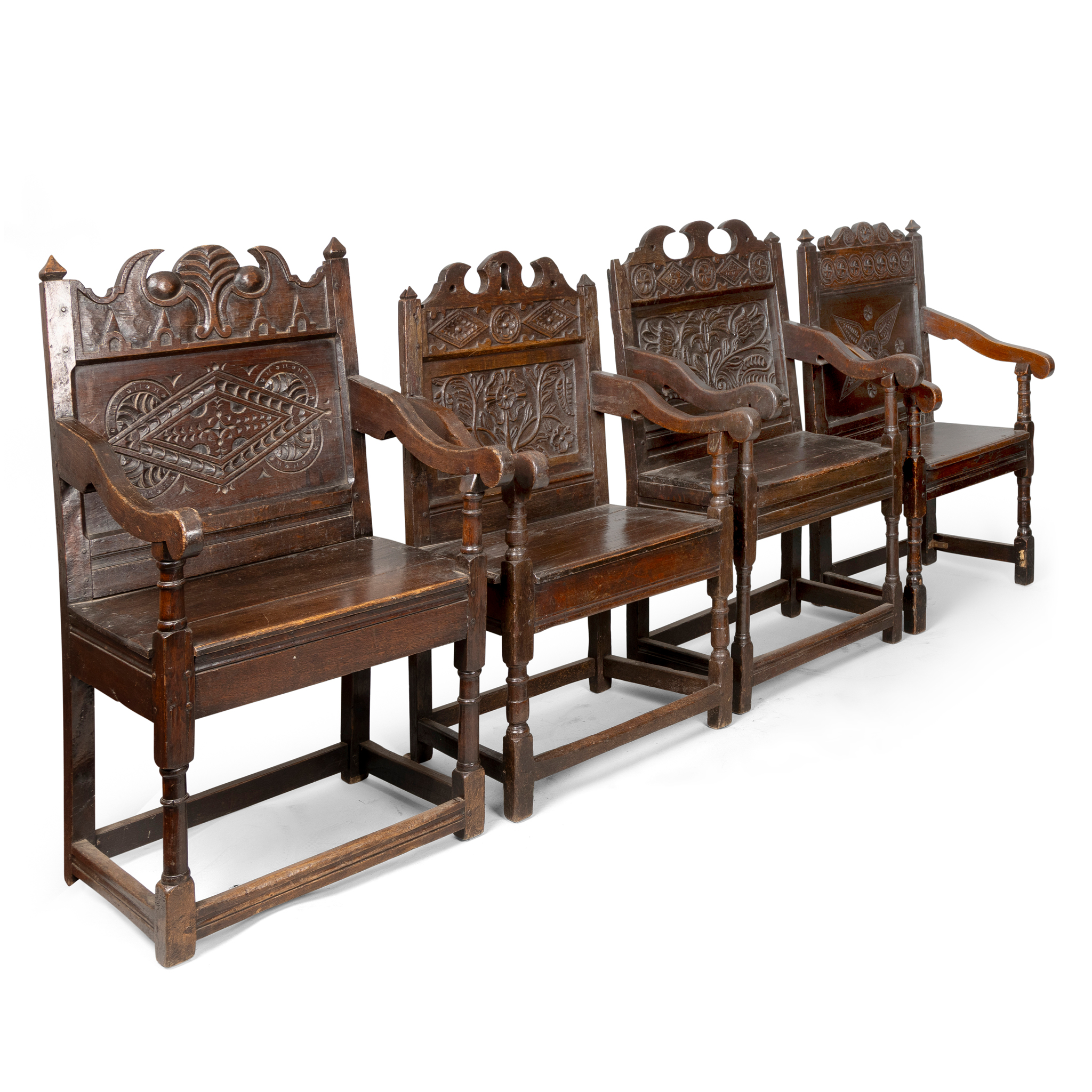 A GROUP OF FOUR OAK ARMCHAIRS