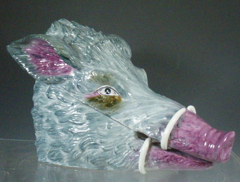 A late 19th century Continental pottery boar's head cheese coaster and cover possibly Dresden