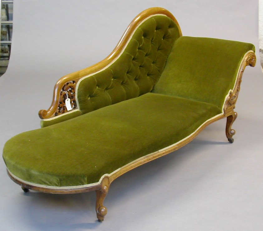 A Victorian walnut framed chaise longue