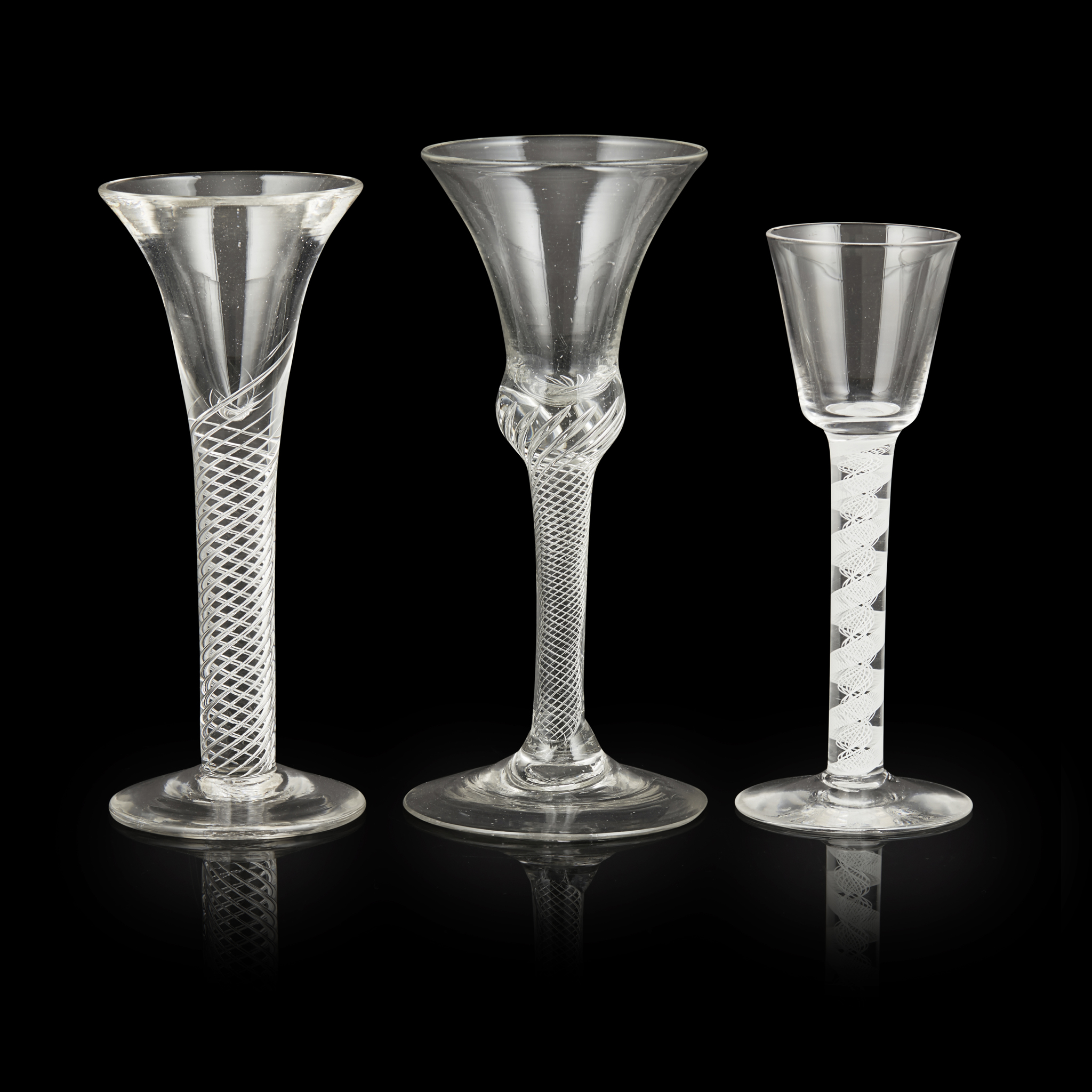 THREE GEORGIAN TWIST STEM WINE GLASSES