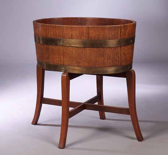 A teak staved planter on stand