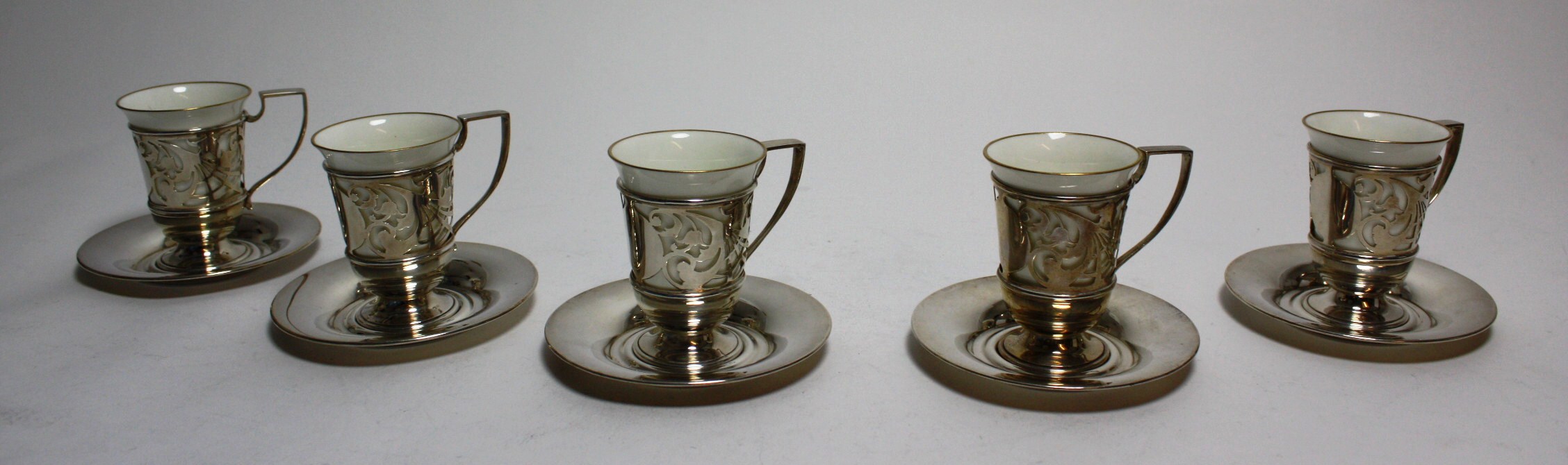 A set of six silver mounted Aynsley cups and saucers