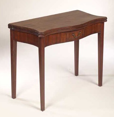 A George III mahogany foldover tea table,