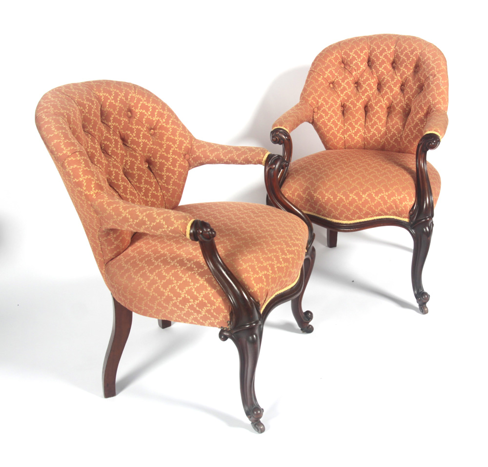 A pair of Victorian style button back armchairs