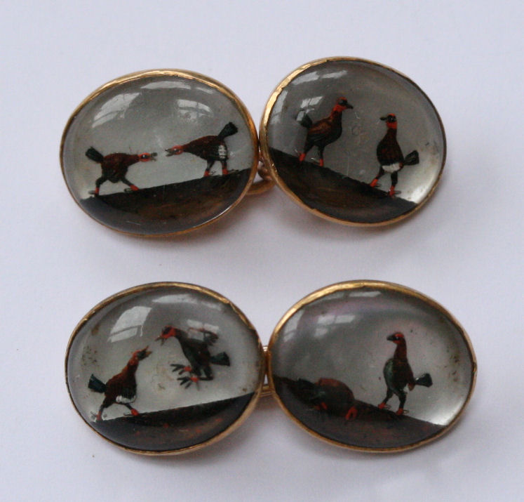 A pair of Edwardian 18ct gold mounted reverse crystal intaglio set cufflinks