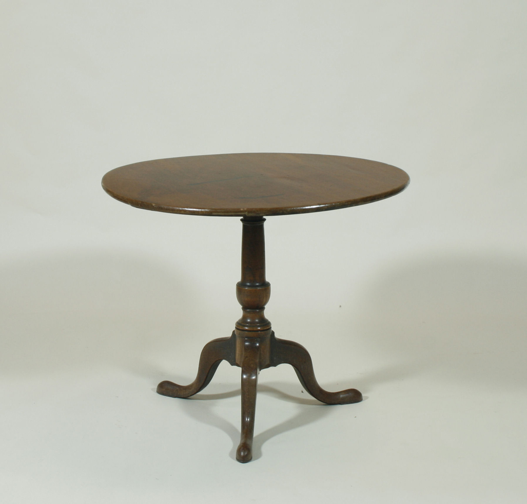A 19th century oak tilt top table