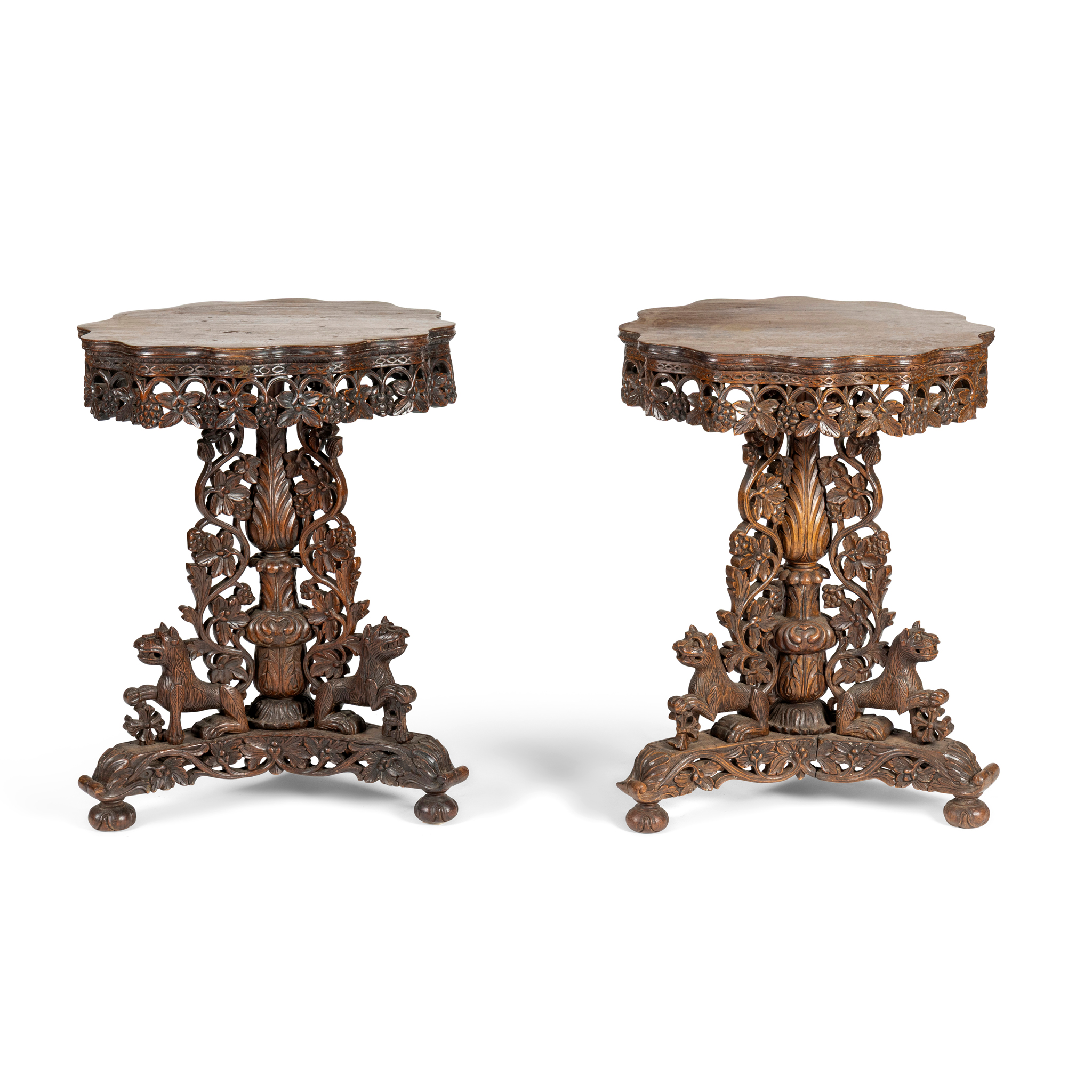 A PAIR OF SOUTH EAST ASIAN CARVED HARDWOOD OCCASIONAL TABLES