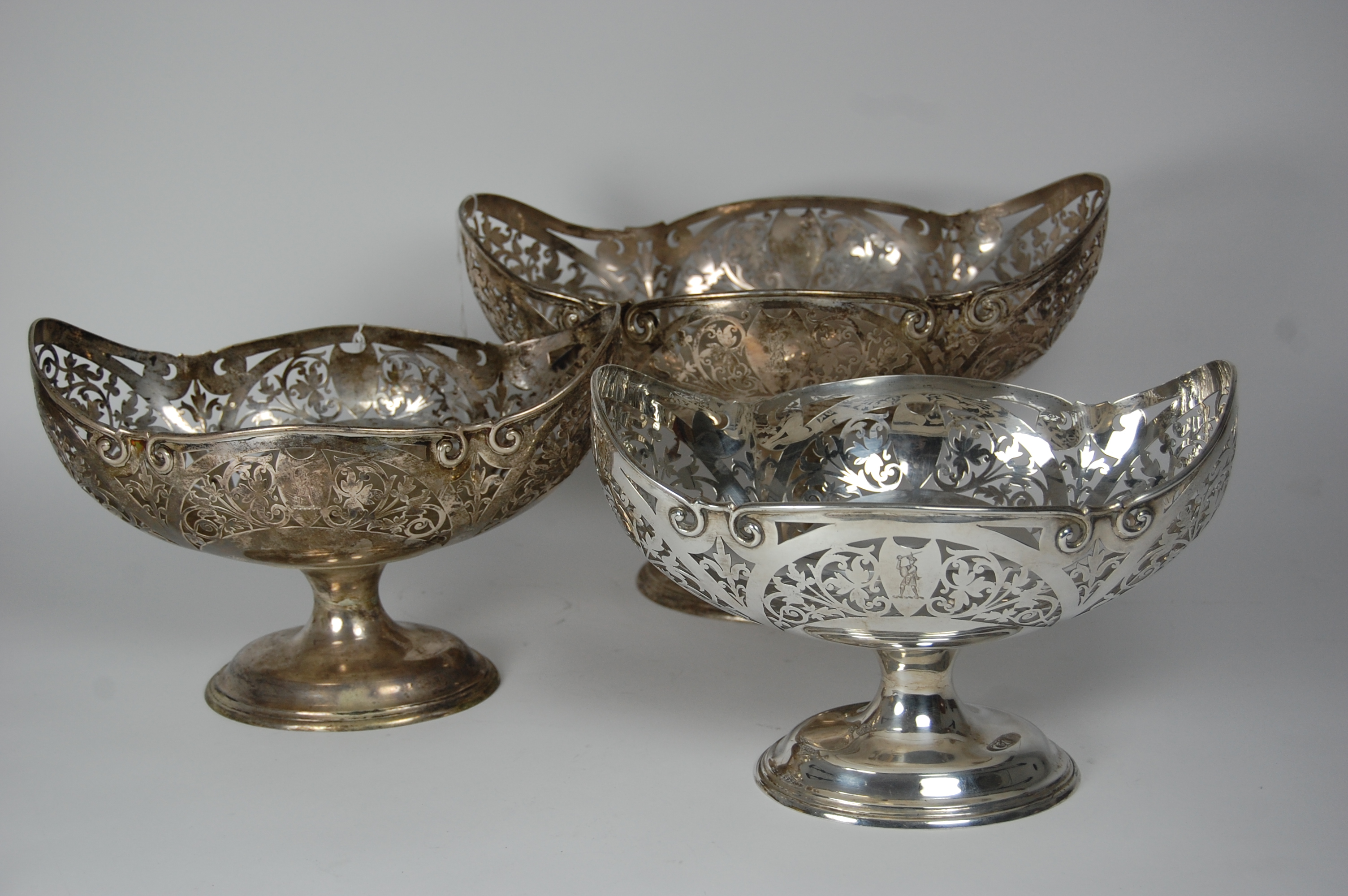 A suite of three Edwardian pierced fruit baskets