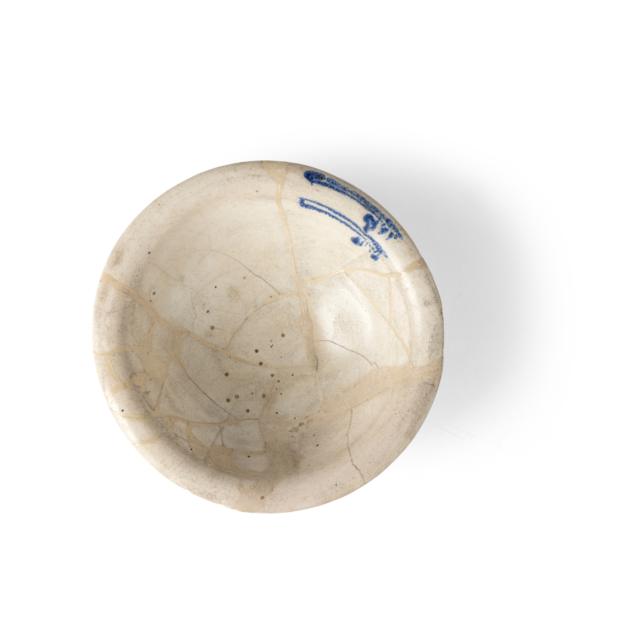 AN ABBASID BLUE ON WHITE POTTERY BOWL