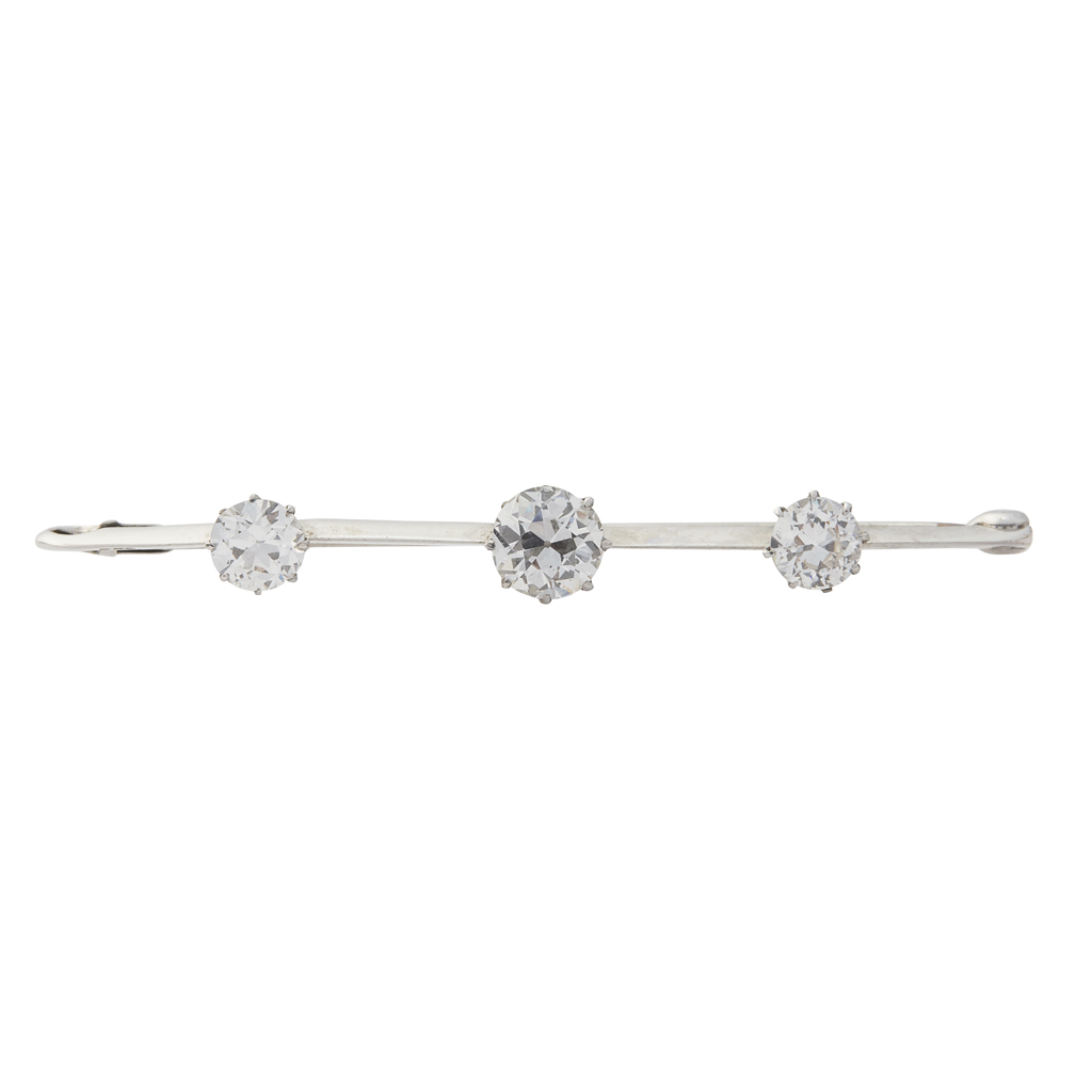 A three stone diamond set bar brooch