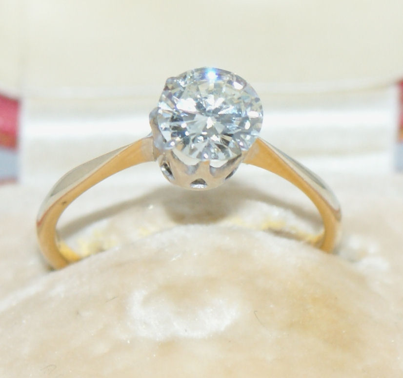An 18ct gold mounted diamond single-stone ring