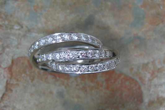 An entwined suite of three diamond rings,