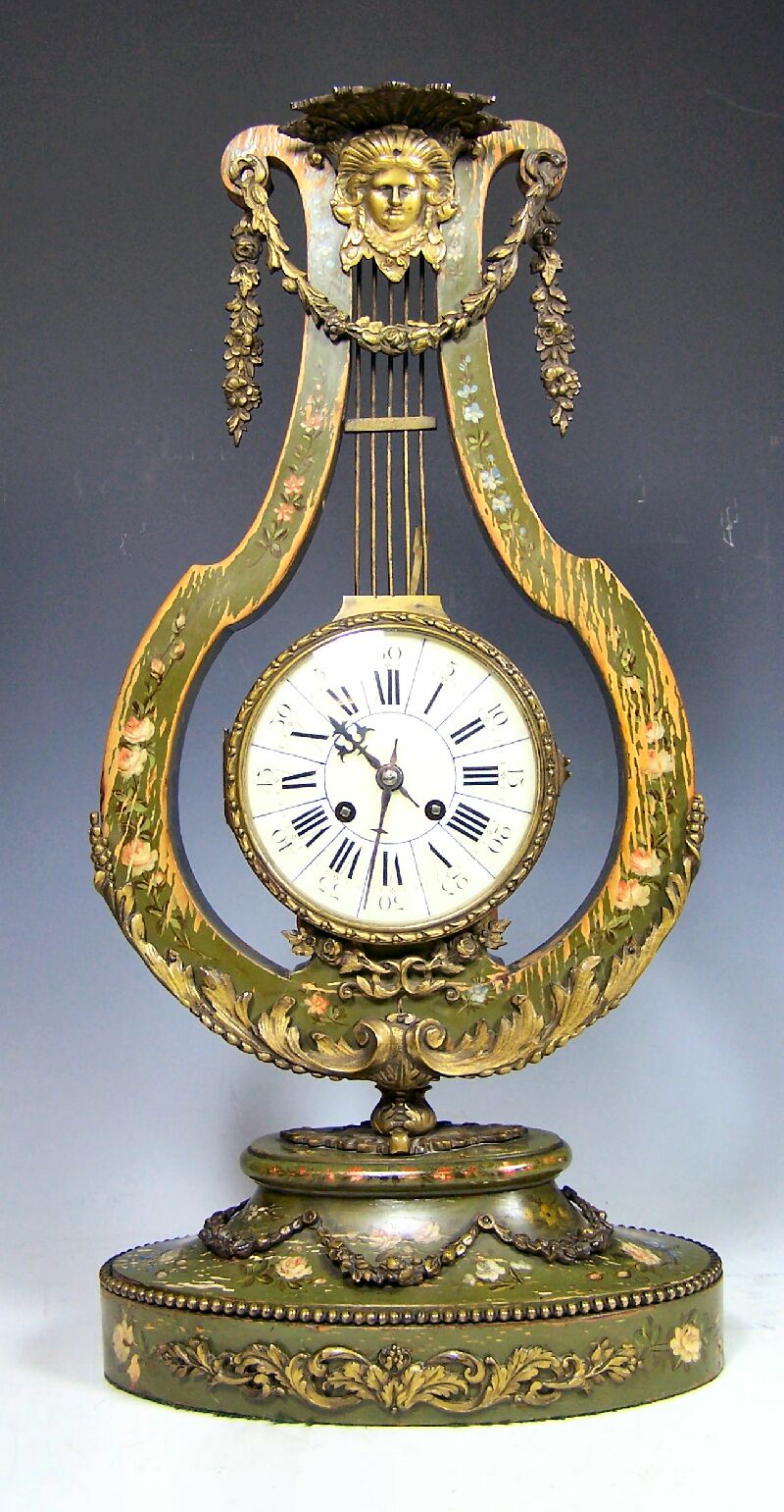 A 19th century French painted beech and giltmetal mounted 'lyre' clock