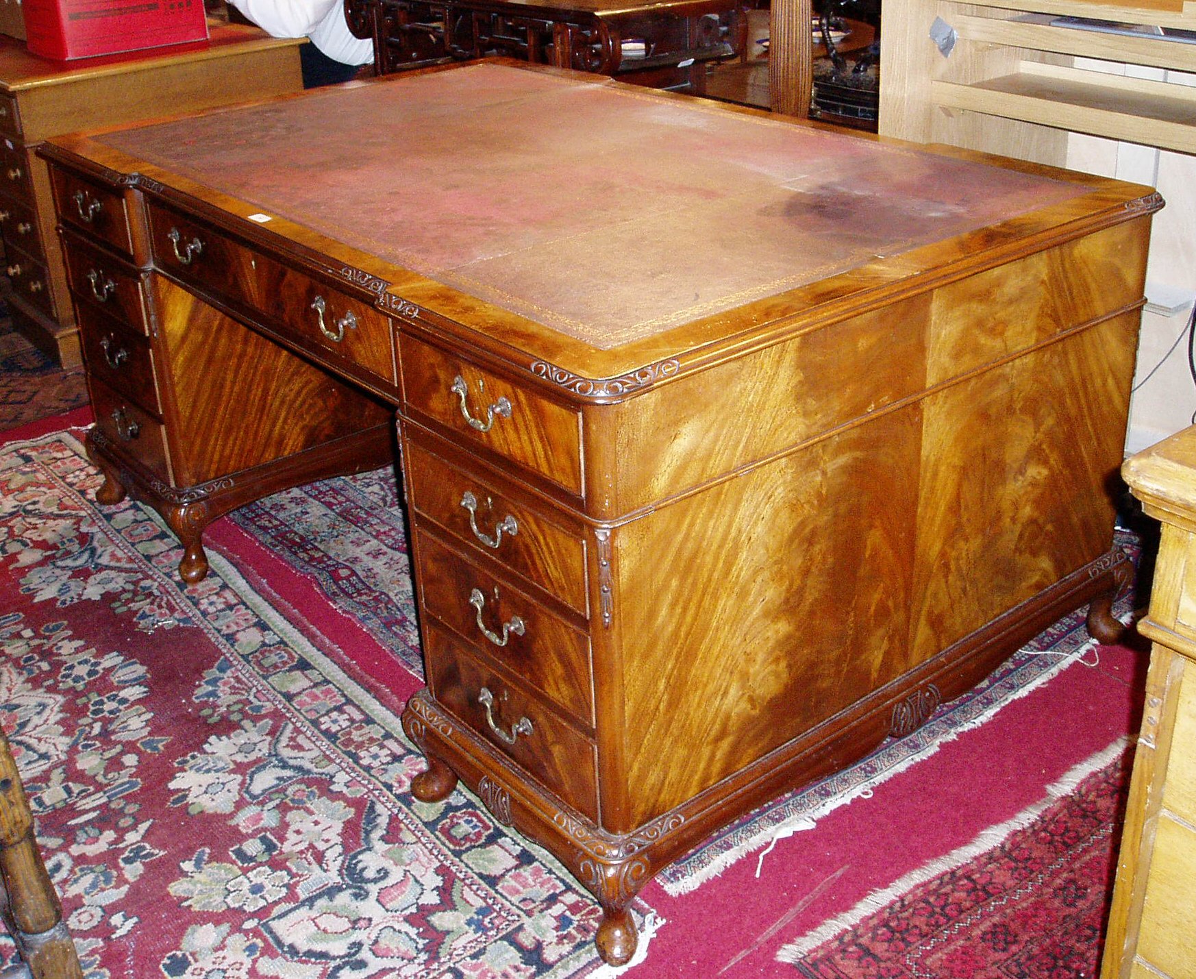 An early 20th century mahogany partner's desk,