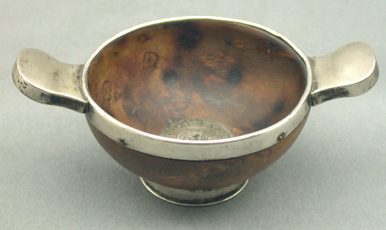 A Georgian mounted bird's eye maple quaich,