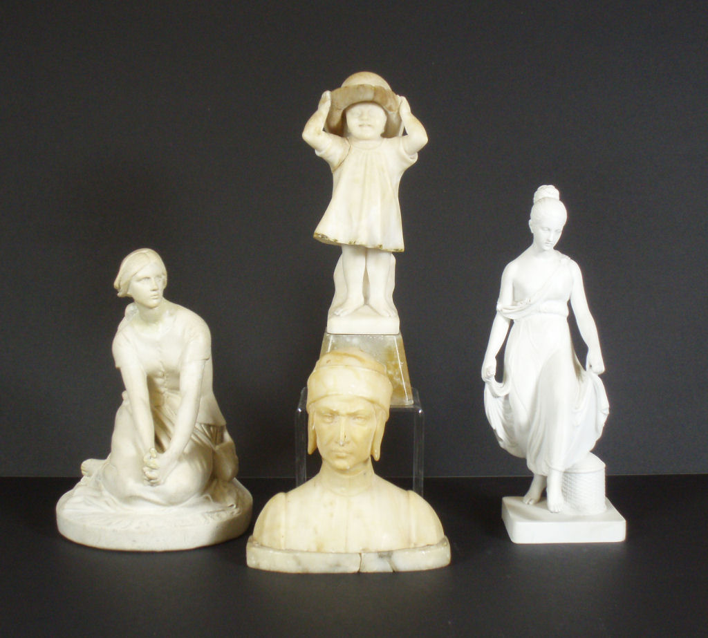 A group of four sculptural figures