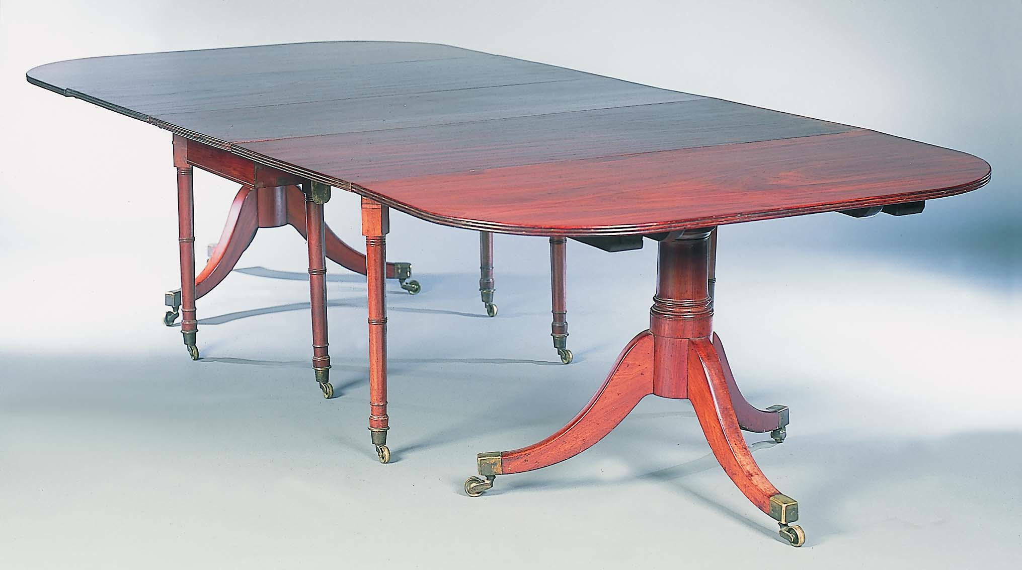 An early 19th century mahogany pedestal dining table