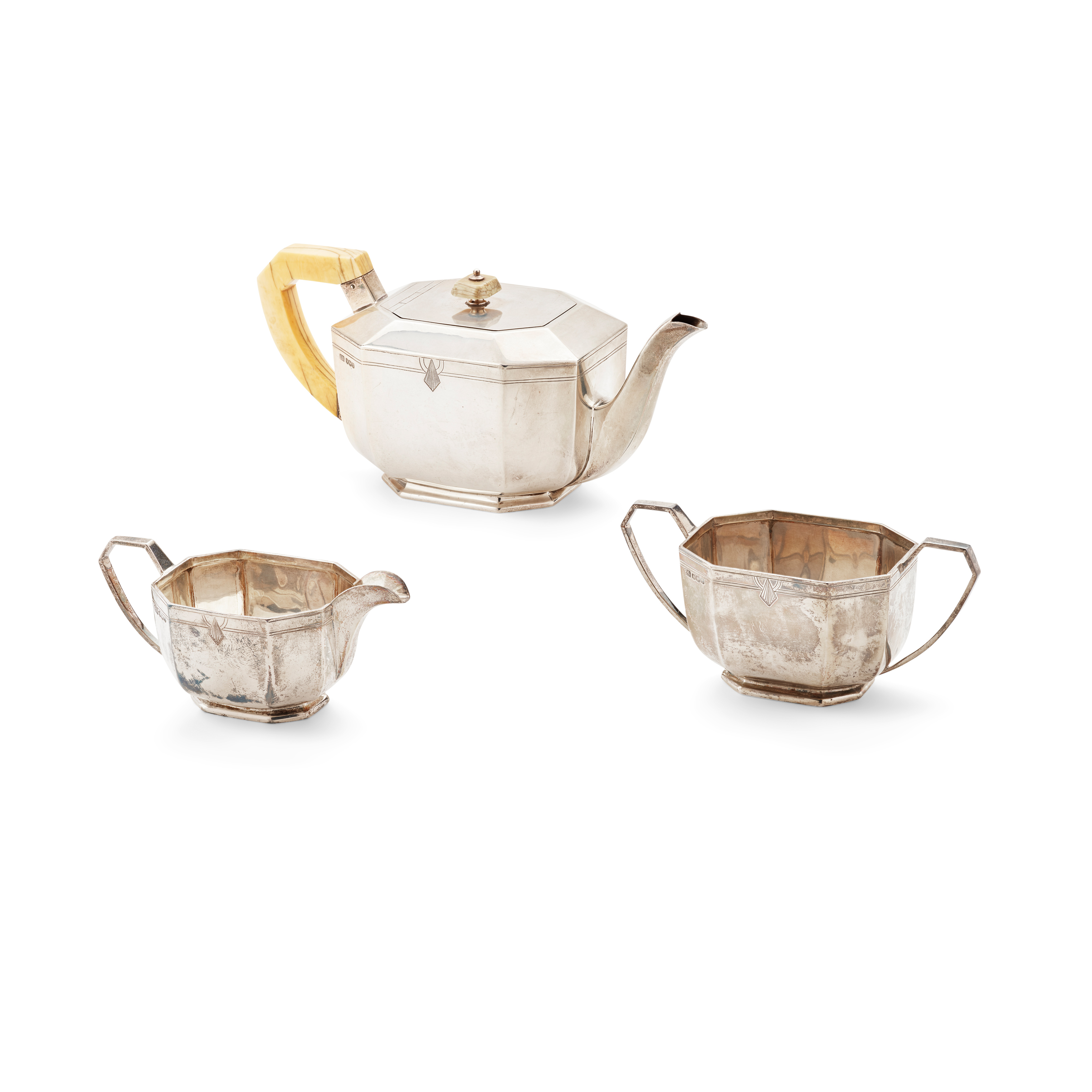 A 1940s ART DECO STYLE MATCHED THREE PIECE TEA SERVICE
