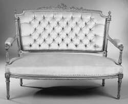 A Louis XVI style giltwood canape
