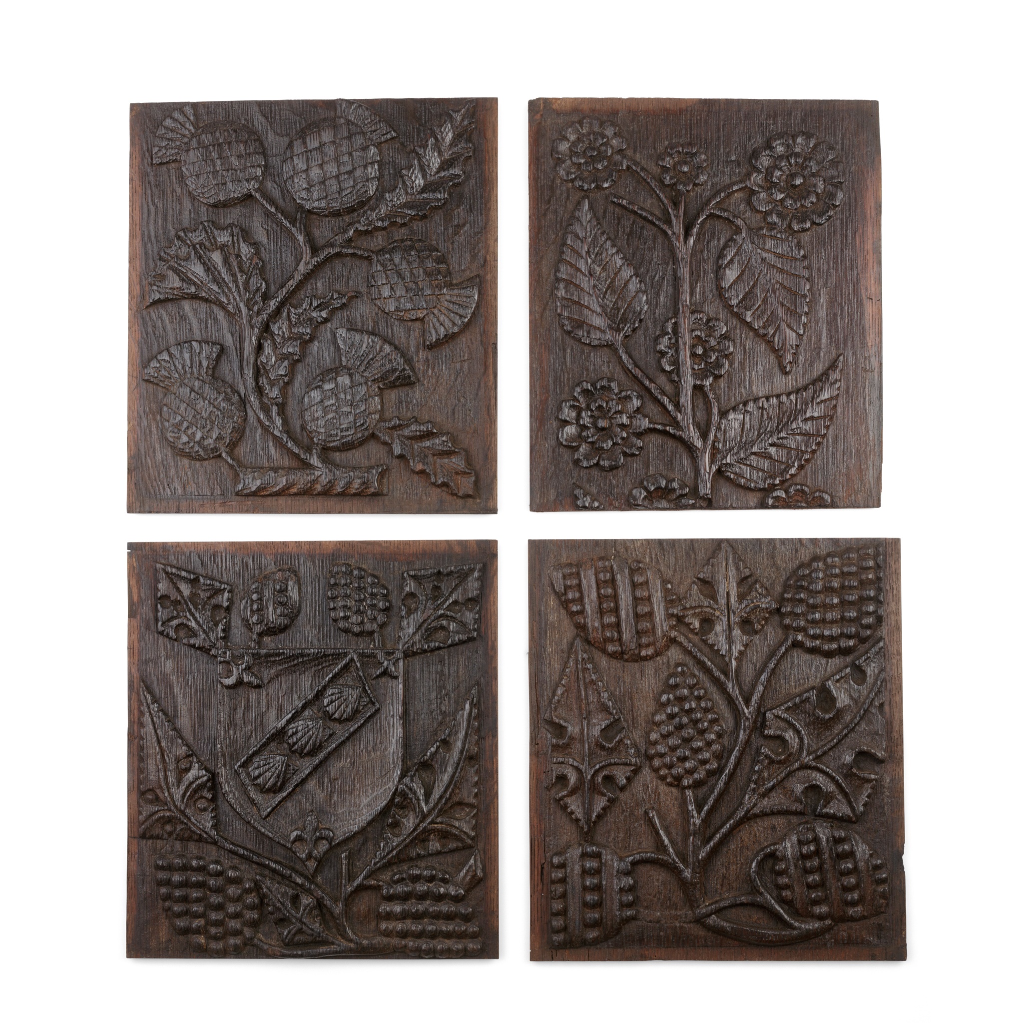 A GROUP OF FOUR CARVED PANELS