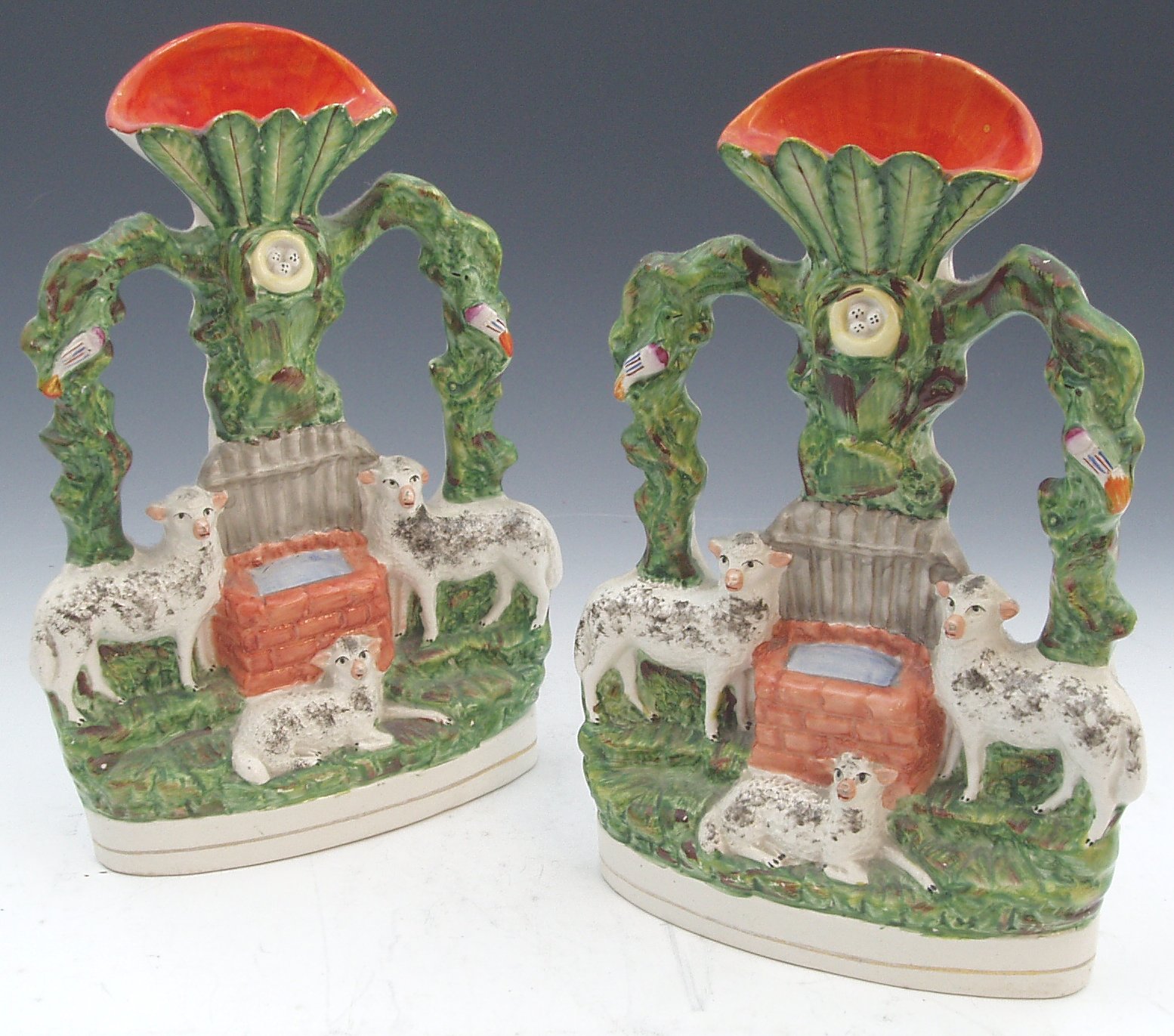 Two Staffordshire flat-back spill vases,