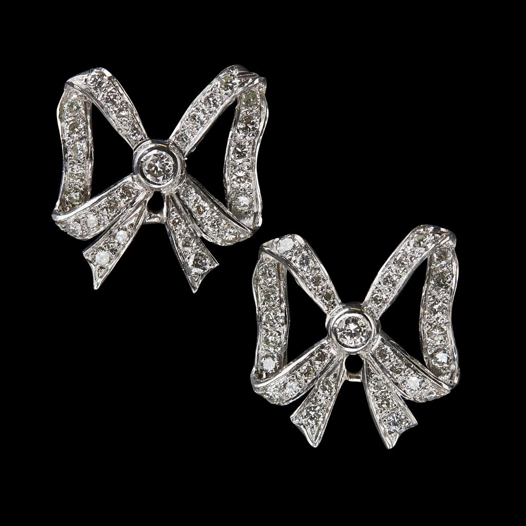 A pair of diamond set earrings