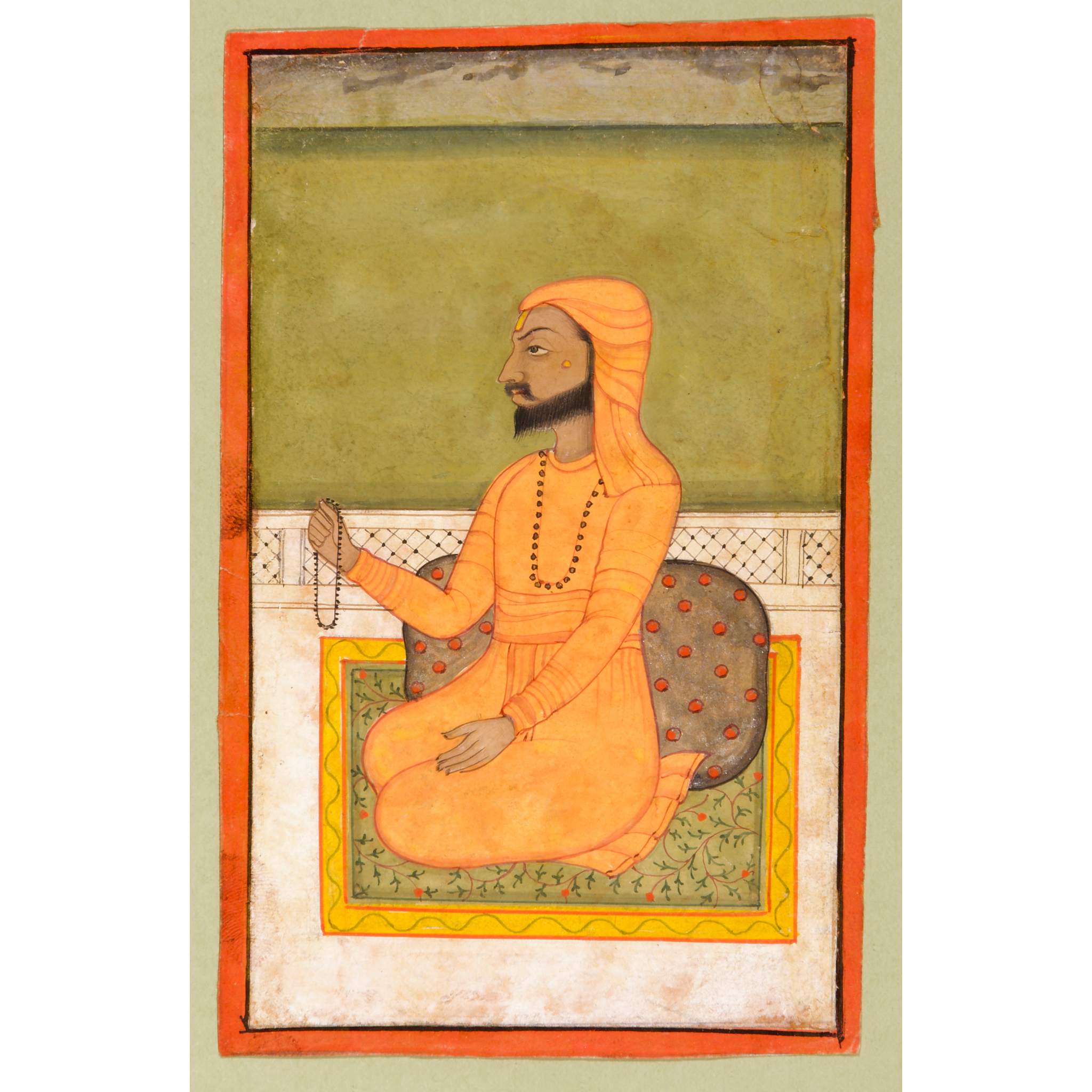 A PORTRAIT OF A SEATED SIKH GURU