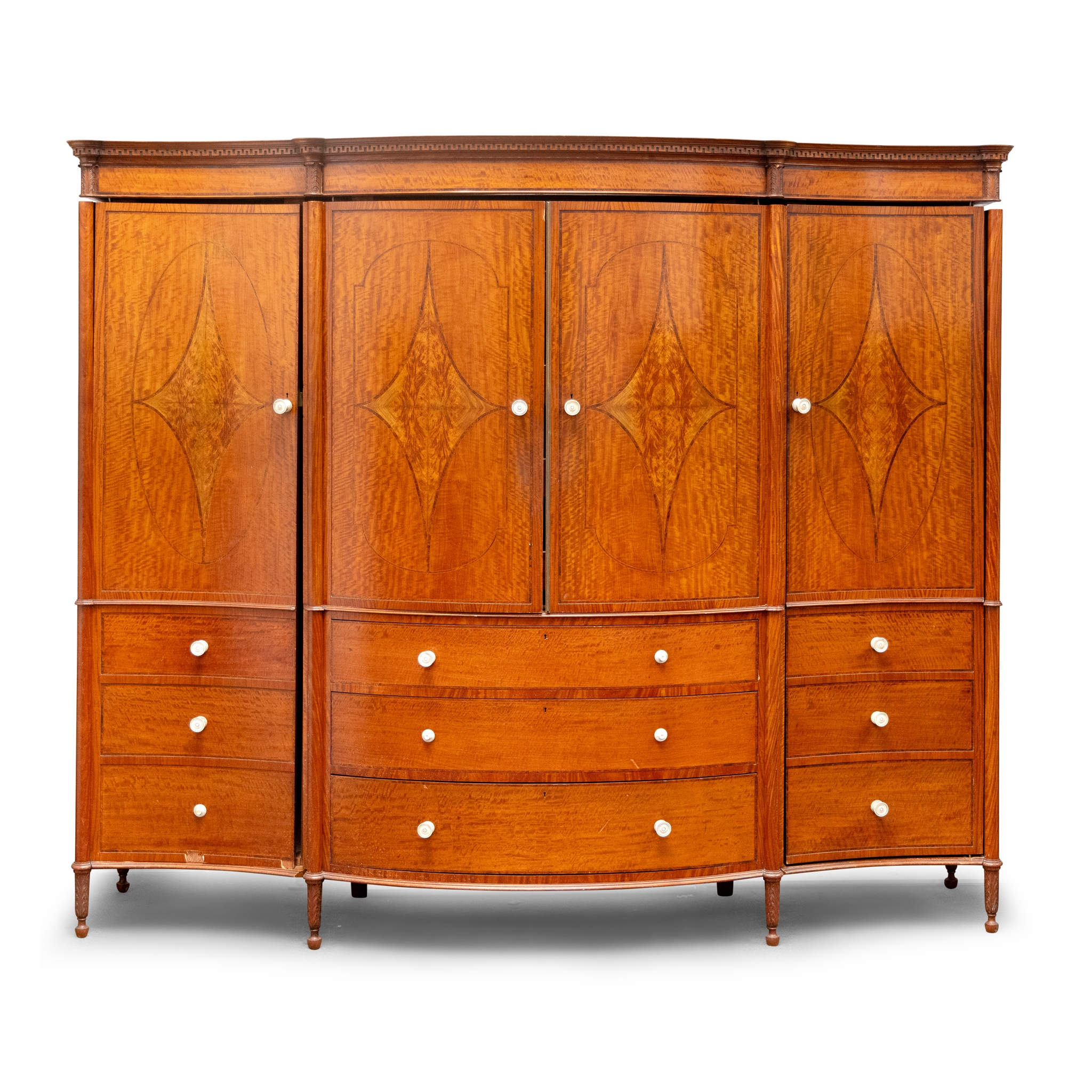 AN EDWARDIAN SATINWOOD INLAID AND CROSSBANDED SERPENTINE FRONTED WARDROBE