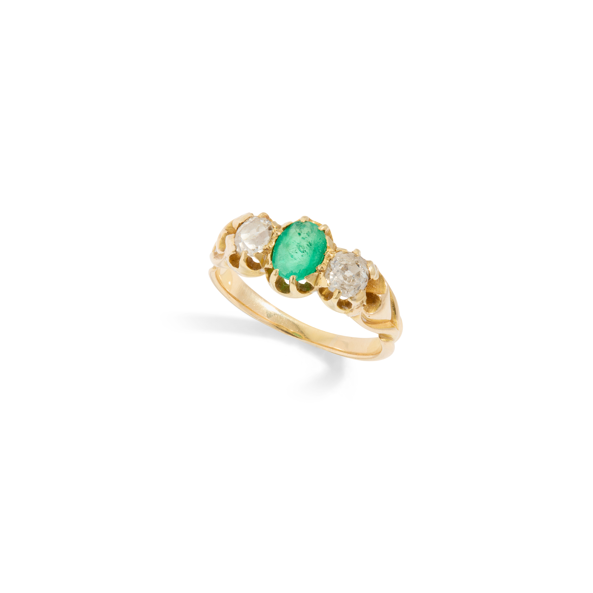 A emerald and diamond three-stone ring