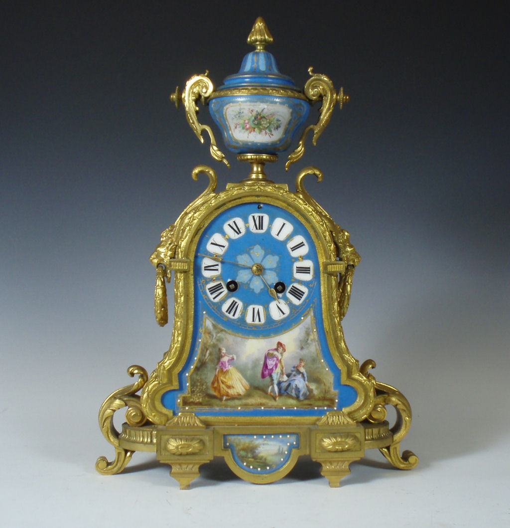 A 19th Century French gilt metal and porcelain mantel clock