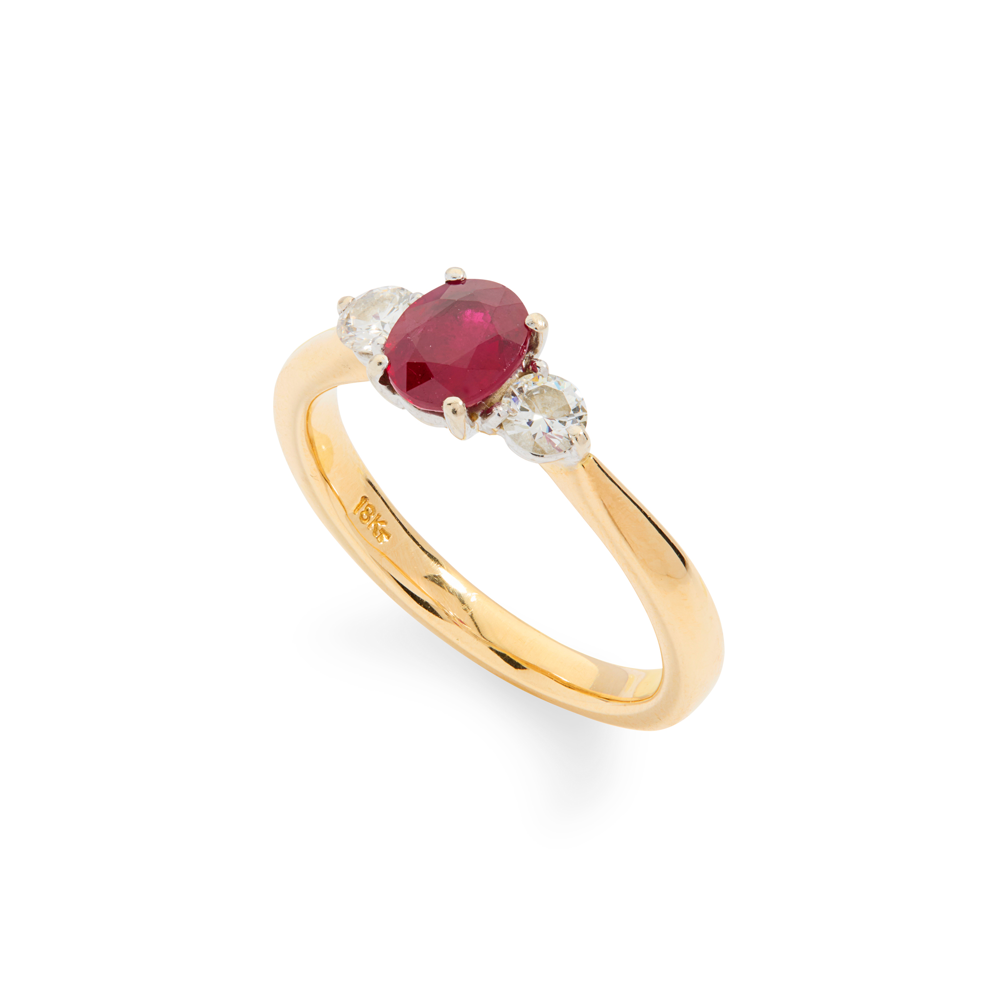 A ruby and diamond three-stone ring