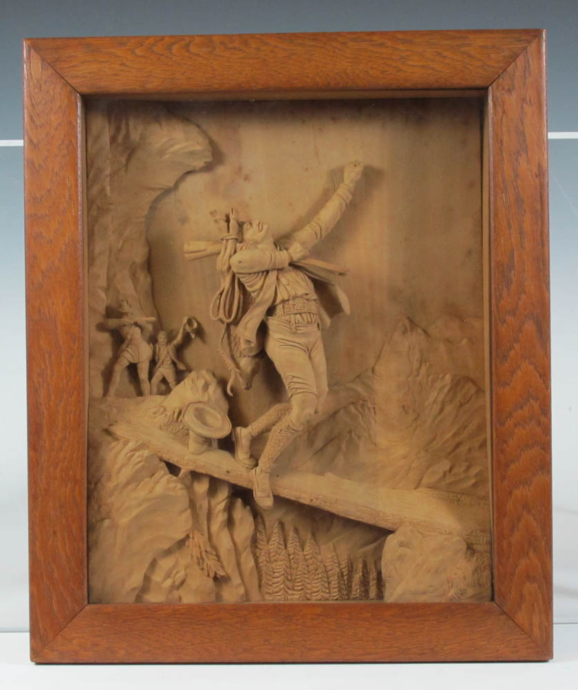 A pair of Swiss Black Forest carved wooden relief panels