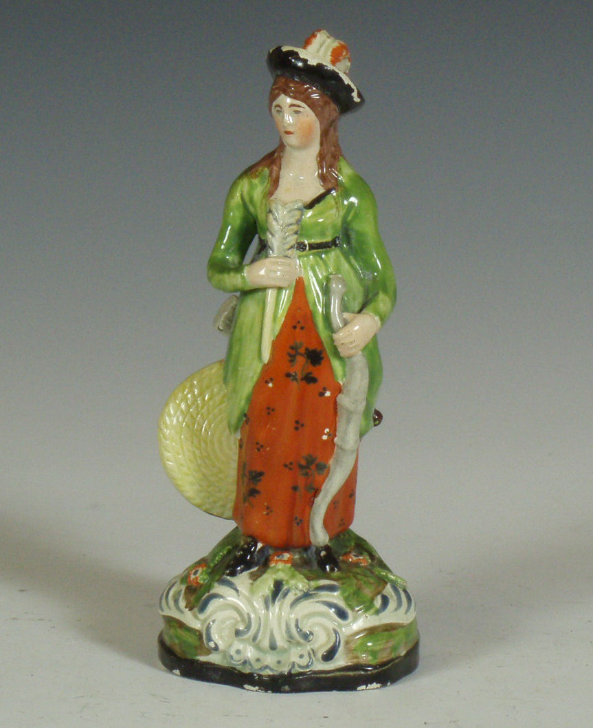 An early 19th century Staffordshire figure of a female archer