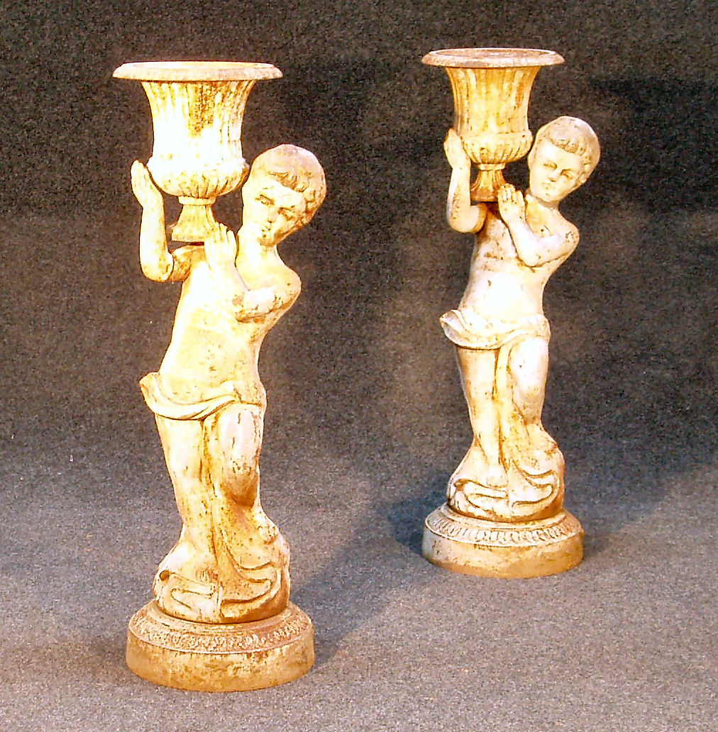 A pair of Victorian cast iron figures of boys