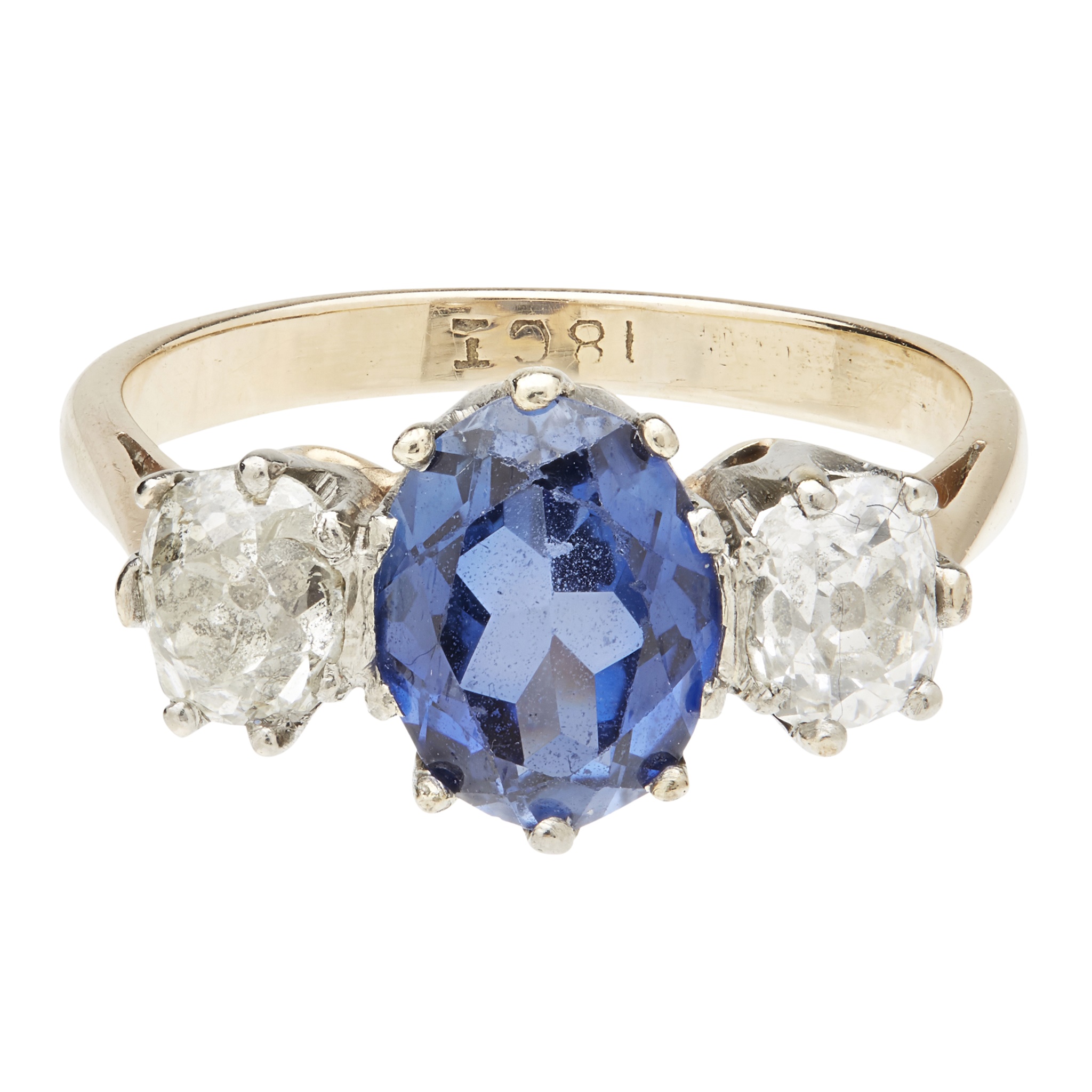 A sapphire and diamond set three stone ring