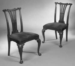 A set of eight Edwardian George II style mahogany dining chairs